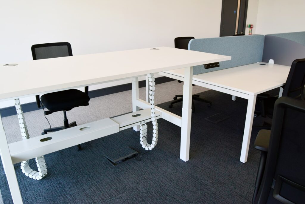 Adjustable desk in the shared office space