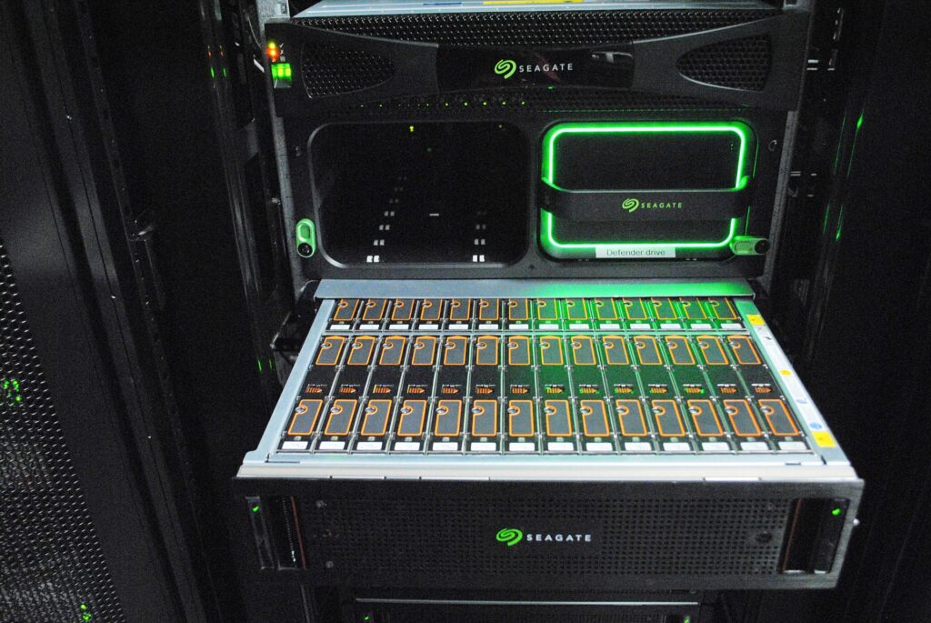 High-performance Seagate storage server at FMCI's mobility data centre, featuring multiple SSD storage modules with a glowing green interface. The system is optimized for handling large-scale autonomous vehicle data, real-time analytics, and AI-driven mobility research.