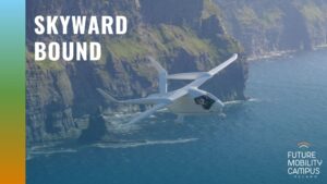 Styalized cover of FMCI's "Skyward Bound" report. The cover features an image of a white electric aircraft flying in front of the Cliffs of Moher. It is BETA Technologies' ALIA CTOL aircraft. On the left side of the image, a colored strip runs doan the side. In the top left corner, the paper's title, "Skyward Bound," appears in white block lettering.